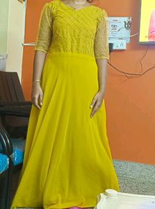 Beautiful Mustard Gown With Netted Layer