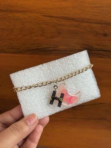 Bracelet with initial letter and real flower