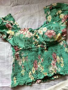 Floral green shirred crop top with puff sleeves