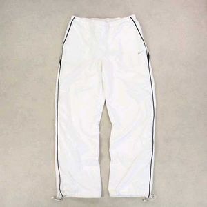 NIKE PARACHUTE BAGGY TRACKS.
