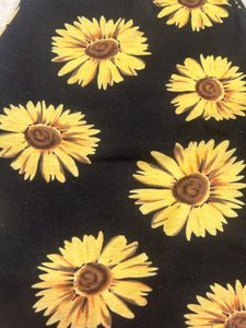 halter neck crop top featuring a vibrant sunflower