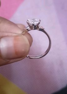 beautifull silver color ring, adjustable with intact stone..