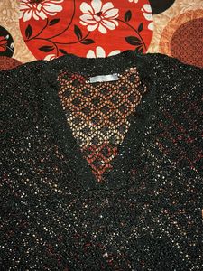 Black sheer top with little sequence work