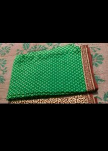 Elegant Green Saree with Flower Design