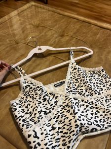 BONKERS corner white and black animal printed top