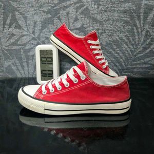Red Low-Top Canvas Sneakers.