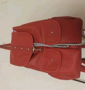 Red Backpack with Multiple Pockets