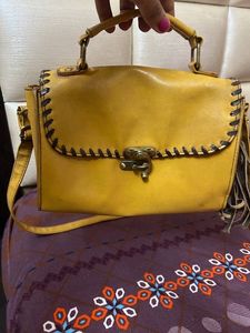 at half rate now mustard hand bag