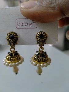 Jhumka, dark green stones and white pearls.