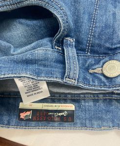 Light blue denim jeans with a cool distressed look