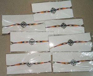 Silver Ganesha Rakhi Set Of 7
