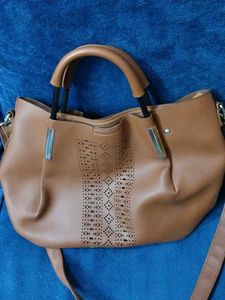 Brown Bag With Cutwork Design In Front