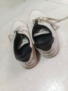 White Sneakers with Feather Design