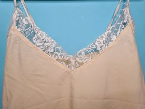 Cream Cami Top With Net Design On Neck.