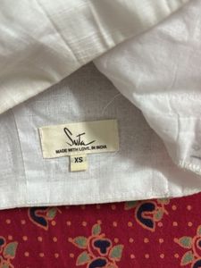 White Sleeveless Blouse