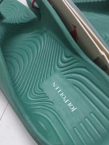 Branded Green flip-flops