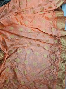 Elegant Orange Saree with Gold Accents