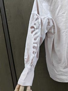 Elegant Blush Top with Lace Sleeves