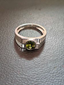 Pure silver ring with green zircon.