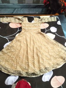 It's Beige color Gown.  I