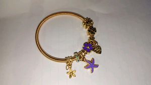 Golden Charm Bracelet with Floral Accents