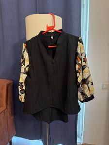 Unique Black Blouse with Patterned Sleeves