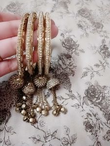 Golden Bangles with Dangling Charms