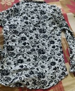 It Is A Shirt With Navy Blue Flowers