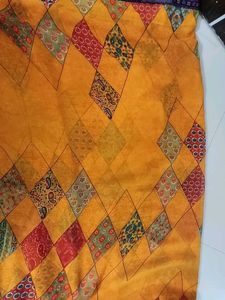 Vibrant  yellow Patterned georgette saree with blo