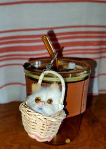 &#34;Fluffy Cat Keyring in Woven Basket&#34;