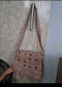very cheap  beige coloured sling / crossbody bag