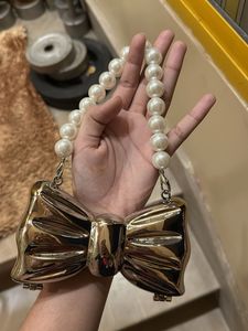 Bow Clutch with Pearl Handle