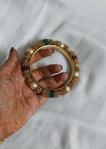 Gold-tone Bangle.