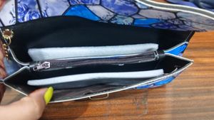 Floral Print Blue Clutch .