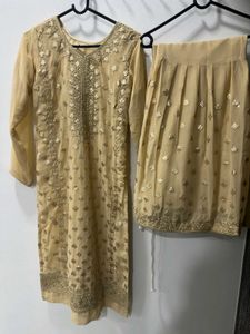 Elegant Cream Embroidered Garara Suit.