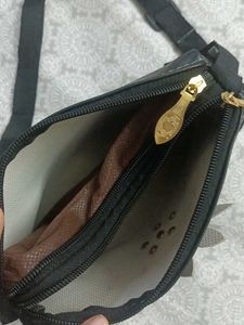 Stylish Black Sling Bag with Floral Cut Design
