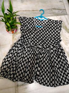 Flared Black Top With Teardrop Detail
