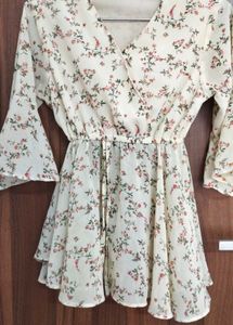 A White Floral Peplum Ruffled Top