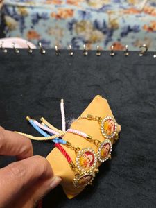 Set Of Four Guruji Thread Bracelets With Cushion