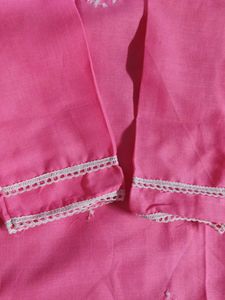 Traditional pink kurti with white embroidery.