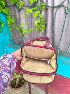 Maroon Shimmery Mini Handbag.