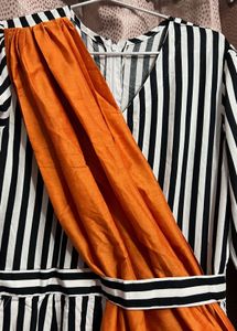 Bold Striped Jumpsuit with Statement Orange Detail
