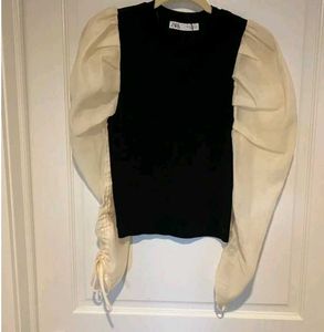 Zara size small black top with cream puffy sleeves