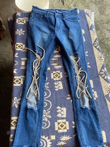 Distressed Lace-Up Jeans
