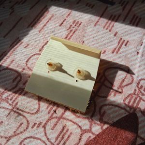 White stoned gold plated earrings