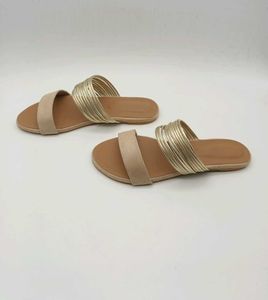 Tan And Gold Flat Sandals.