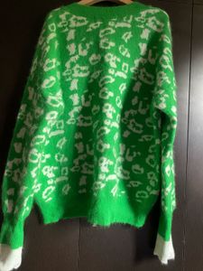 Green Jumper with White Accents