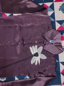 Elegant Purple Satin Garment with White Flower
