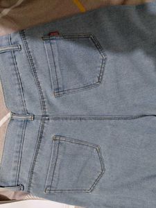 Light Wash Jeans with Button Detail