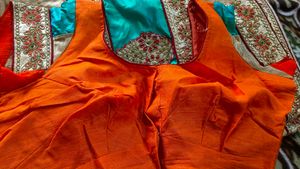 Orange Saree With Turquoise And GoldenBorder